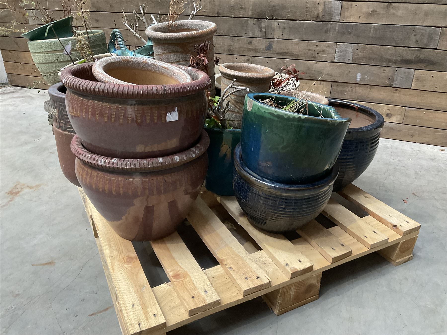 Large collection of ceramic plant pots and paving slabs, (26)