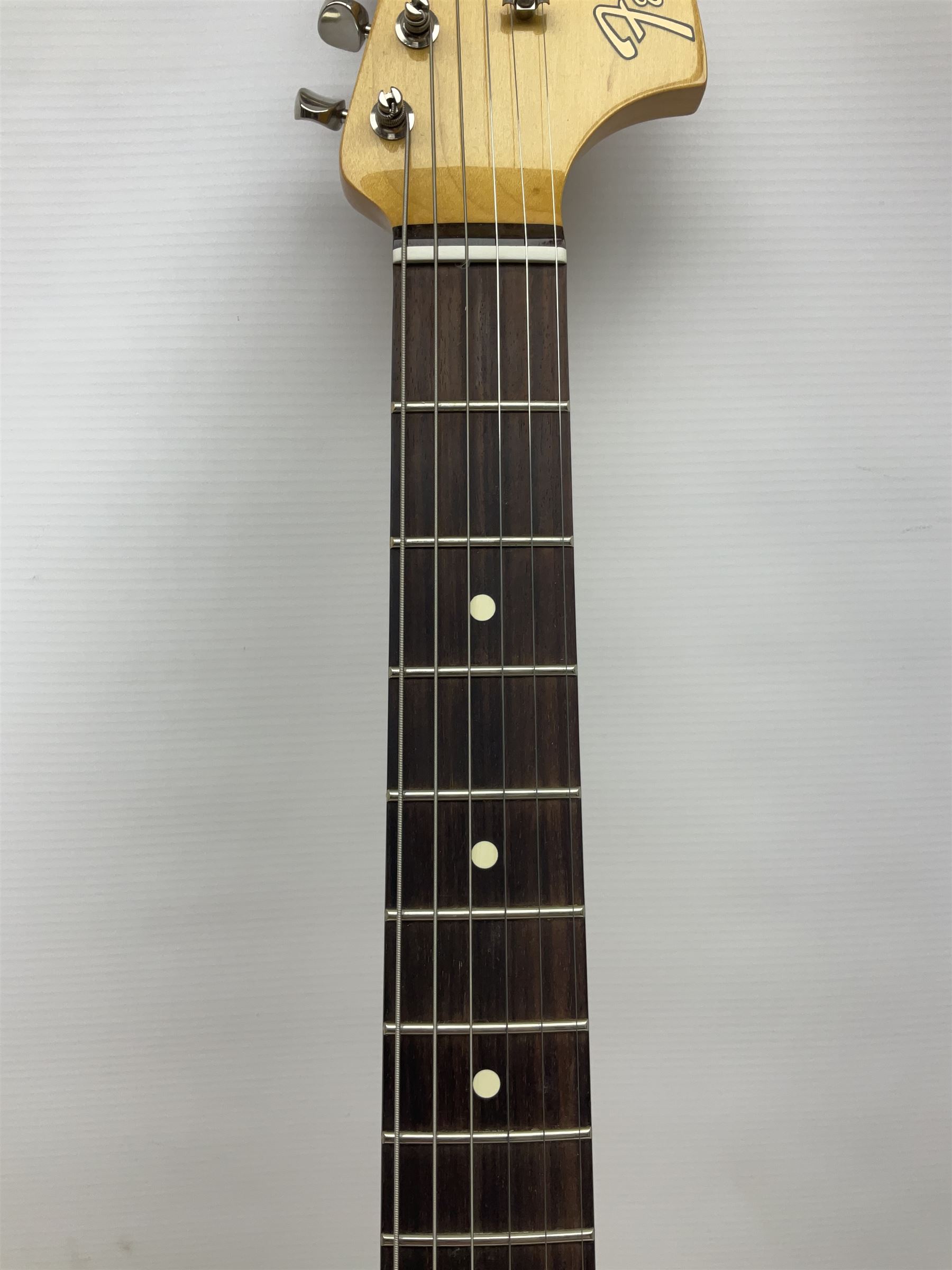 Mexican Fender Jaguar electric guitar with Humbucker pick-ups and tremolo arm, serial no.MX16741977, L101cm; in soft carrying case