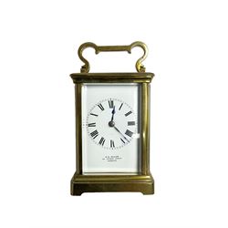 W.R. Cullen, London Street. Norwich. - 8-day French carriage clock c1900, in a corniche case with carrying handle and four bevelled glass panels, white enamel dial with Roman numerals, minute markers and spade hands, with a lever platform escapement and rack striking movement striking the hours and half hours on a coiled gong. 