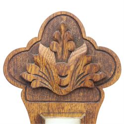 Late Victorian carved oak aneroid barometer, the foliate crest above a glazed thermometer and circular dial, with further carved decoration below, H 75cm