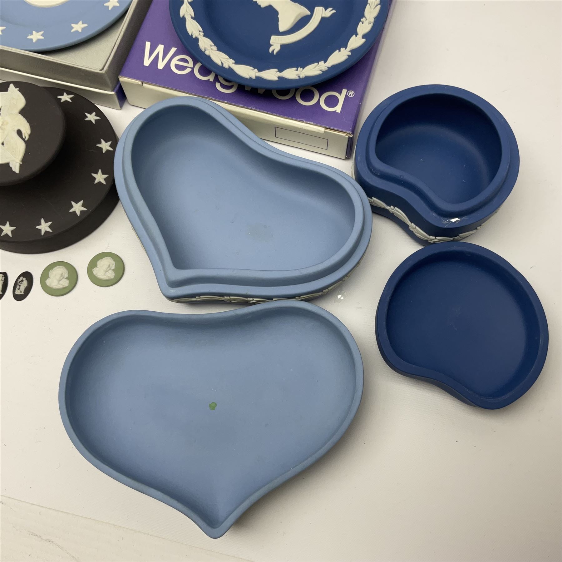Collection of Wedgwood Jasperware, to include black Eisenhower Bust, two black basalt paperweights, one depicting an eagle and one depicting Julius Caesar, a blue Zodiac plate, Man on the Moon commemorative plate, American Independence Bicentennial plate and Royal commemorative ware, etc, all with impressed marks beneath, some with boxes