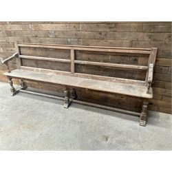 Victorian pitch pine bench pew, turned arms and legs, rail back with plank seat, 249cm