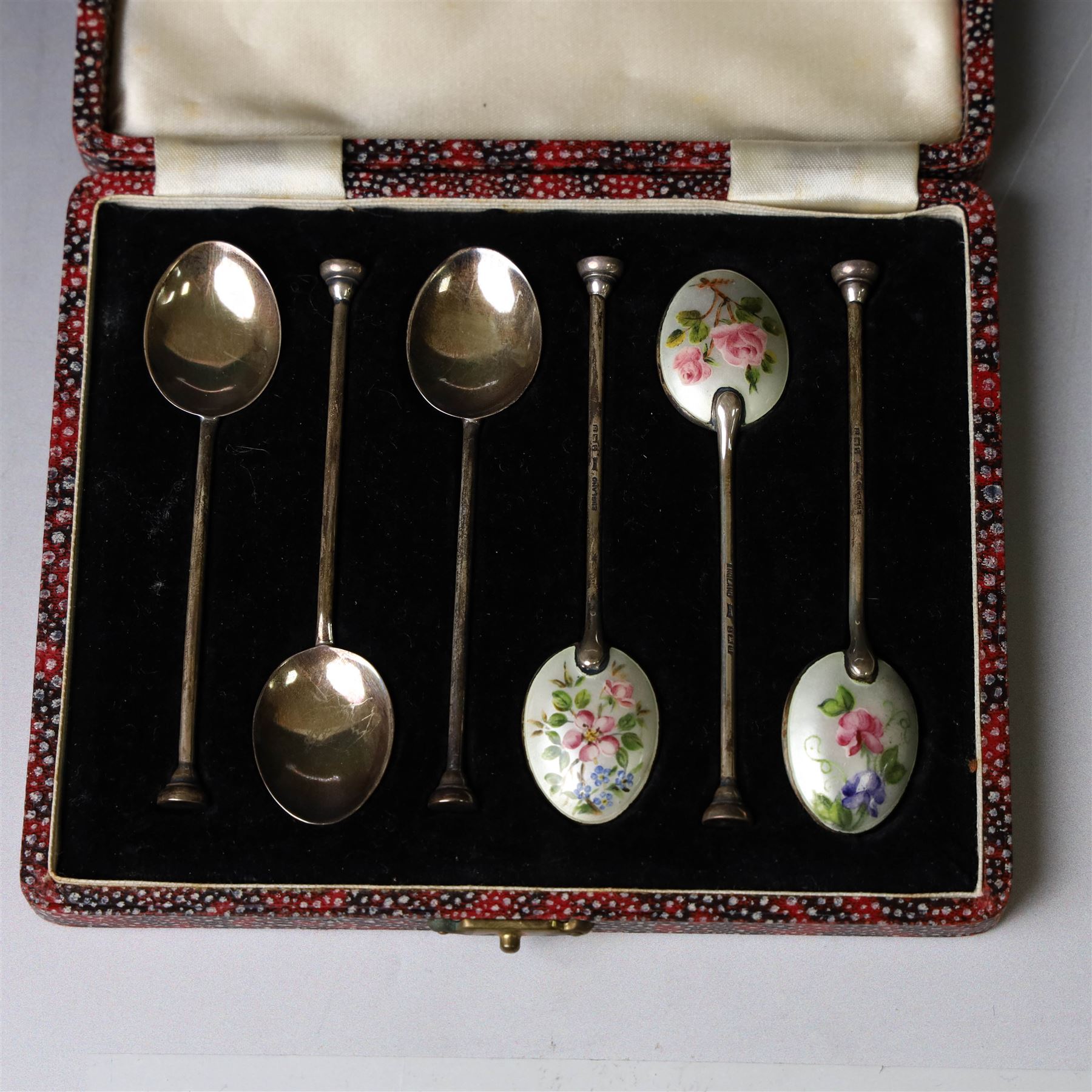 Set of six enamel coffee spoons, each decorated with guilloche enamel flowers to the underside of the bowls,  hallmarked Walker & Hall, Birmingham 1951, in fitted case