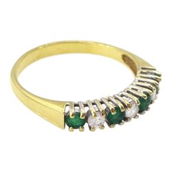 18ct gold seven stone emerald and round brilliant cut diamond ring, Birmingham 1989
