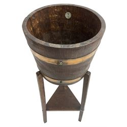RA Lister & Co, Dursley - early 20th century oak jardinière plant stand, coopered barrel on three splayed supports united by undertier 