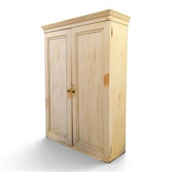 19th century stripped pine linen cupboard, projecting cornice over two panelled doors enclosing five assorted shelves