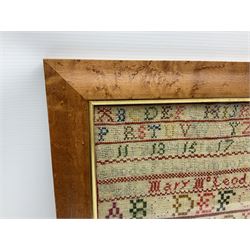 Victorian sampler by Mary McLeod Age 10, and dated 1854, depicting a three storey house with animals in garden to the fore, flanked by trees and peacocks, beneath bands of alphabet and numbers, in birdseye maple frame, overall H52cm W41.5cm