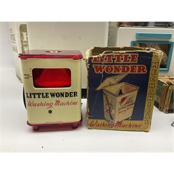 Six toy kitchen appliances - Casdon battery operated cooker; Mettoy Hoover washer; Chad Valley Hoovermatic washer; Wells Brimtoy tin-plate clockwork washer; and two Morphy Richards irons; together with a continental child's Regina sewing machine; all boxed (7)