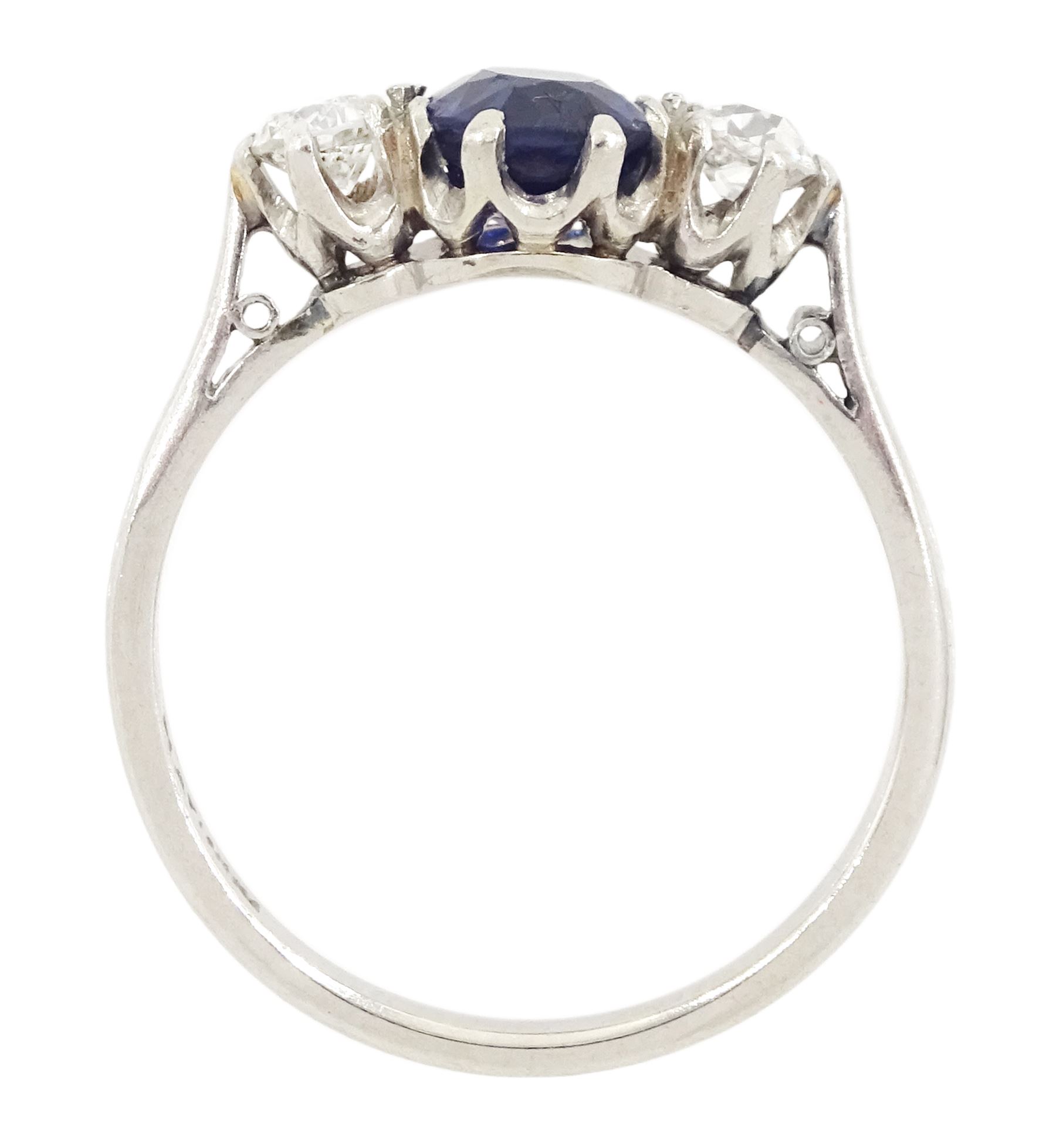 Early 20th century platinum three stone oval cut sapphire and old cut diamond ring, stamped, sapphire approx 1.10 carat, total diamond weight approx 0.30 carat
