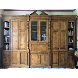  Bespoke figured oak freestanding bookcase/display cupboard, fitted with multiple panelled doors, fall front compartment and glazed display doors (H270cm, W380cm, D60cm) By repute purchased from Harrods circa 2000. Situated at a property in North Leeds. Viewing by appointment only, please contact William Duggleby for further information on 01723 507111  