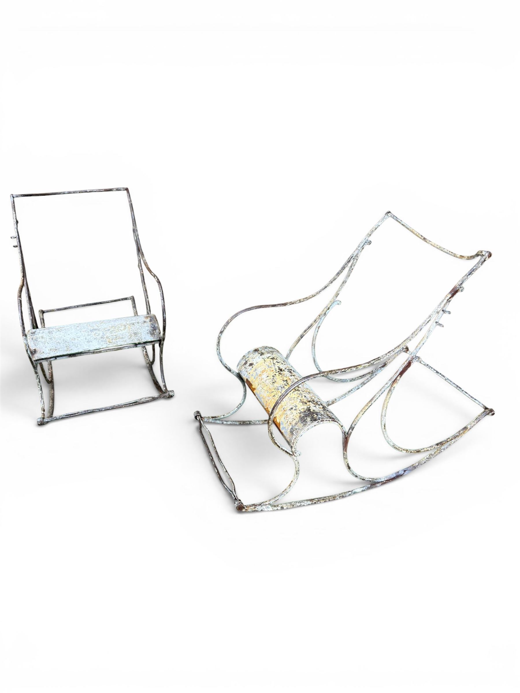 Pair of large unusual 19th century wrought iron garden rocking chairs, simple scroll design, lacking canvas seat