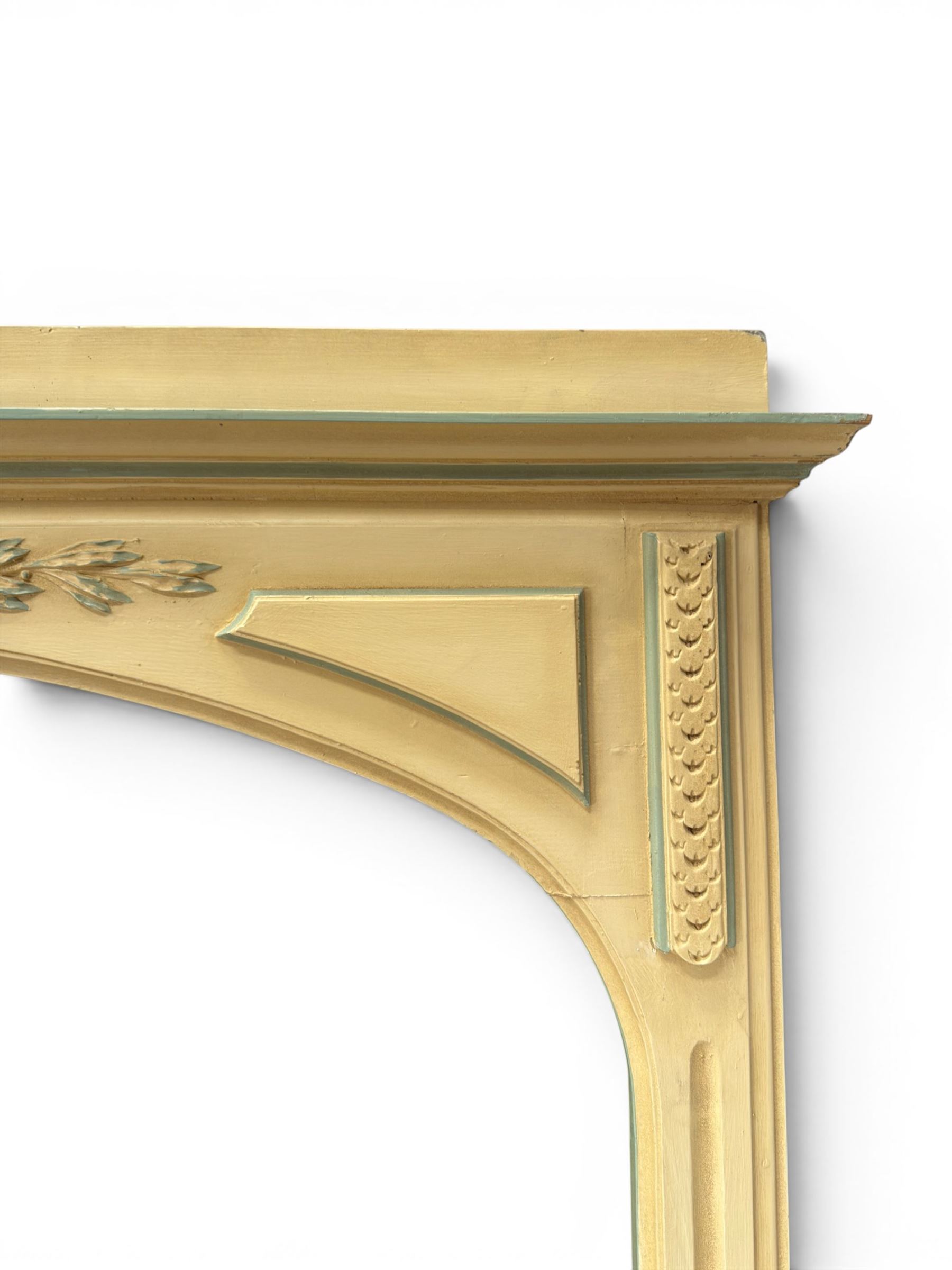 Two large painted pine window or door surrounds, square cornice with arch top, applied mouldings (widths 180cm and 130cm)