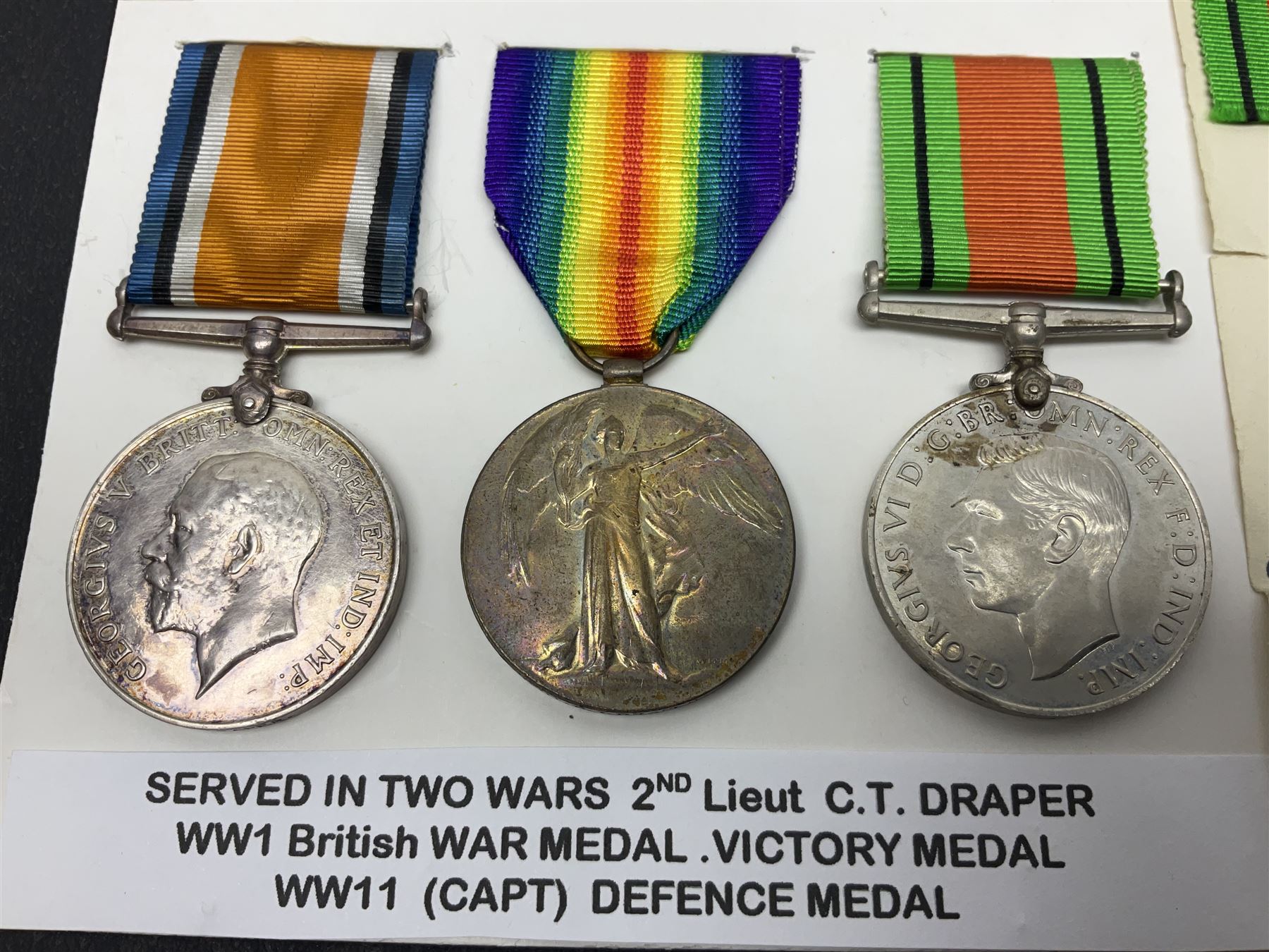 WWI pair of medals comprising British War Medal and Victory Medal awarded to 2nd Lieutenant C.T. Draper; and WWII Defence Medal awarded to Captain C.T. Draper with War Office letter of confirmation; all with ribbons (3)