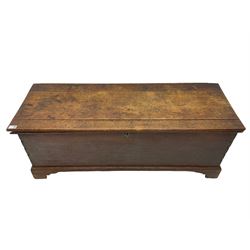 18th century oak blanket chest, the hinged lid over plain front, visible dovetailed construction, on bracket feet