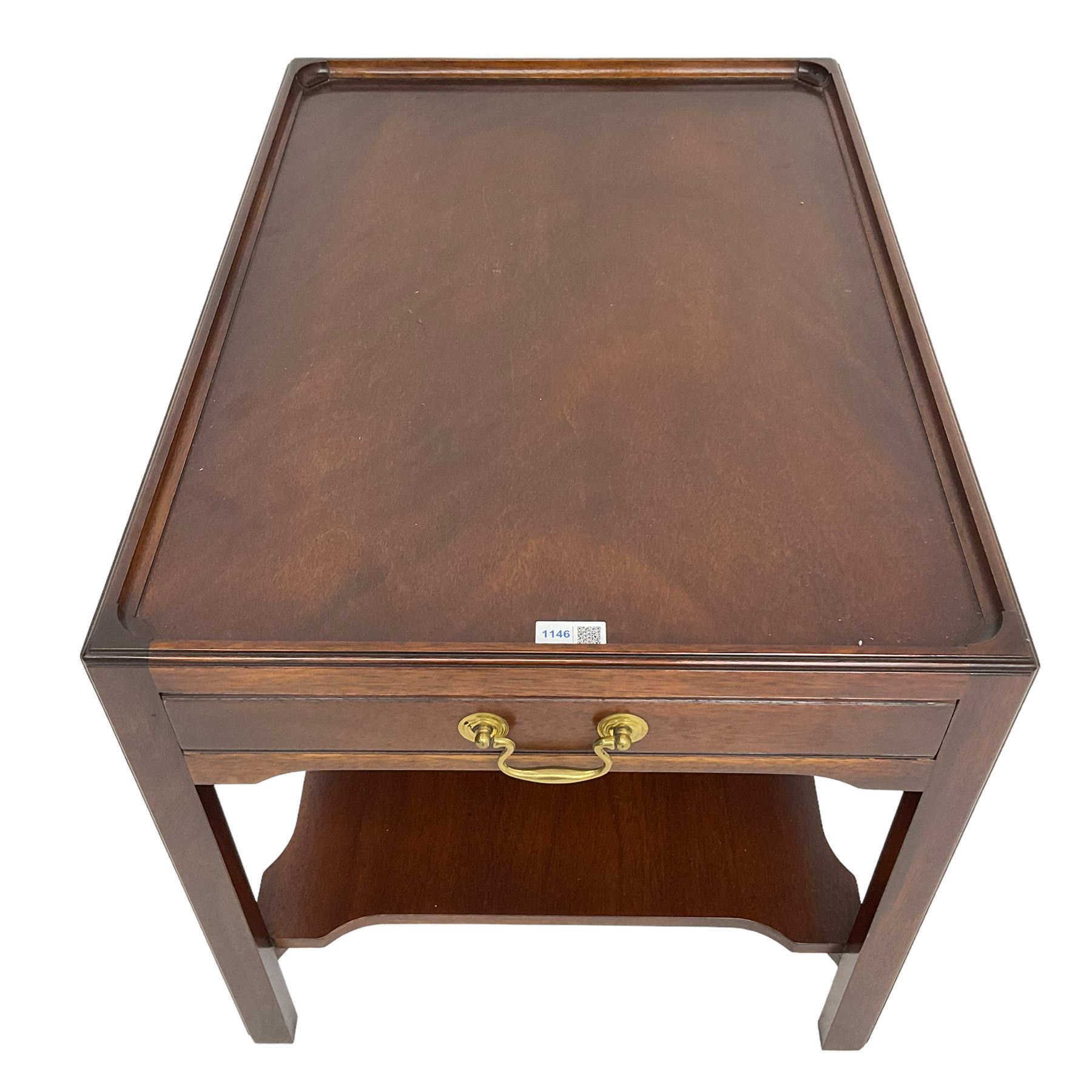 Mahogany side table or end table, the dished rectangular top with moulded edge, fitted with single end drawer, moulded square supports with inner chamfer united by under-tier 