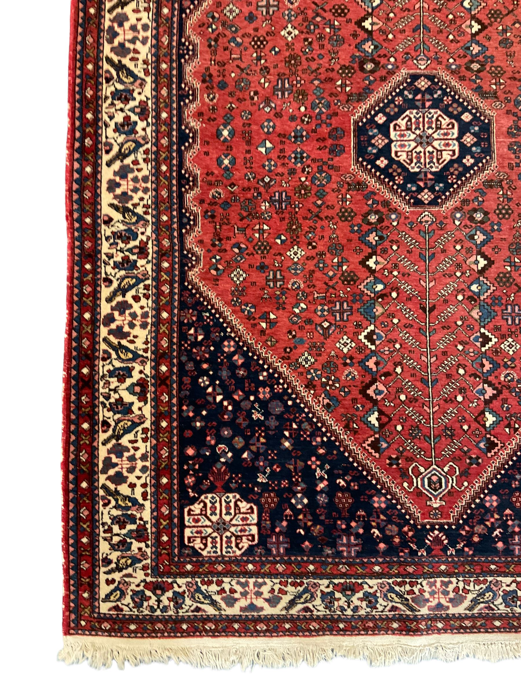 Fine Persian blue and red ground woollen rug