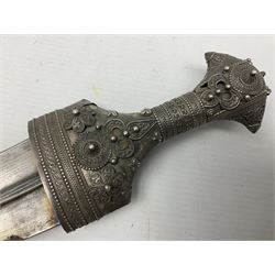Omani Khanjar dagger, the 19cm curved blade with pronounced medial rib to either side, waisted hilt with dome shaped pommel and silver covered horn grip decorated with filigree bands, floral motifs and beadwork; in an intricately filigree decorated silver and leather scabbard with silver rings woven into the belt mount and fitted with original silver thread-work belt L34cm overall belt length 94cm