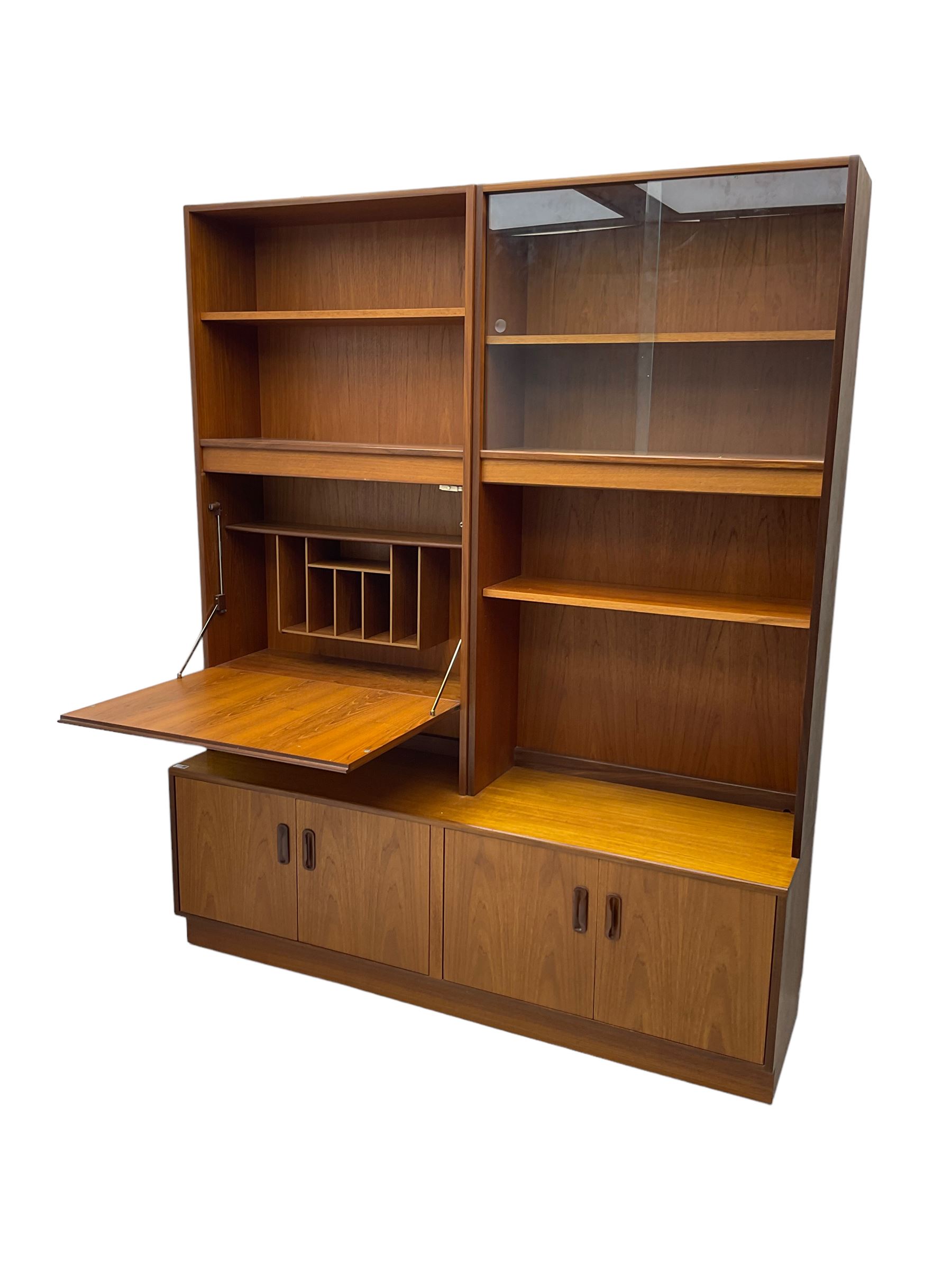 G-Plan - mid-20th century teak modular wall cabinet, fitted with shelves, display cabinet, fall front compartment and two double cupboards