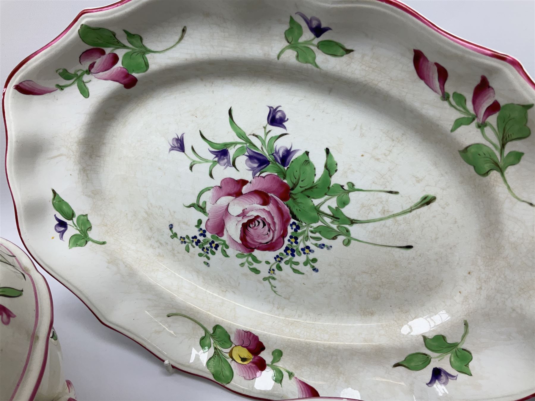 Matched Copeland Spode, Spode and French Luneville and Marlborough Sprays pattern dinner and tea wares, comprising two tureen and covers and apple finials, two sauce tureen and covers with pear finials and fixed stands, six graduated platters including two pairs, large plate, thirteen dinner plates, twelve bowls, ten smaller bowls, eight side plates, eleven smaller side plates, teapot, twin handled sucrier and cover with apple finial, open sucrier, cream jug, smaller cream jug, four breakfast cups, eight tea cups, four large saucers, eleven smaller saucers, and nine further smaller saucers. 