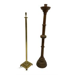 20th century oak ecclesiastical candle stick (H154cm), and a brass standard lamp