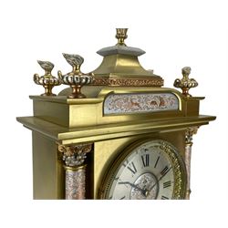 French - late 19th century 8-day patinated and silvered brass cased mantle clock, with a tiered pediment surmounted by a central finial with mounted flambé finials to the corners, silvered two-part dial with Roman numerals, steel hands and a cast bezel flanked by two circular columns with Corinthian capitals, with contrasting applied filigree decoration to the pediment, pillars and front of the case, rectangular stepped plinth with a decorative base on block feet, Japy Freres twin train Parisian movement with square movement plates and rack striking, sounding the hours and half-hours on a coiled gong. With pendulum.