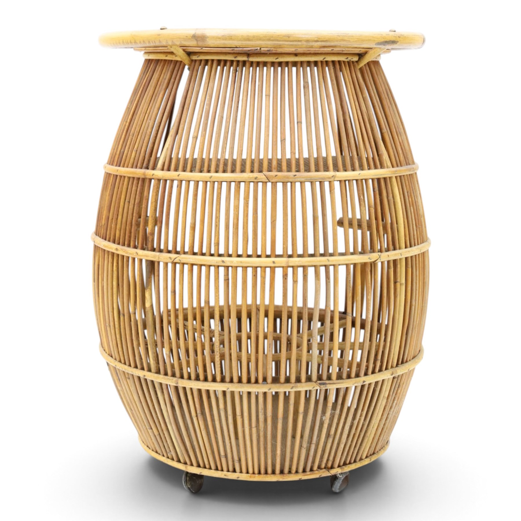 Italian mid-20th century barrel-shaped bar cart in rattan and bamboo, the circular top with rattan and bamboo handle, above a rattan shelf with bamboo bottle dividers below, raised on castors