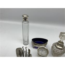 Pair of Georgian silver navette shaped salts with blue glass liners, hallmarks worn and indistinct, silver matchbox cover embossed birds, mask and scrollwork, hallmarked W J Myatt & Co, Birmingham 1902, Pepper shaker, G. Bryan & Co., Birmingham 1939, together with small group of silver mounted glass jars and silver handled button hooks and accessories, various hallmarks