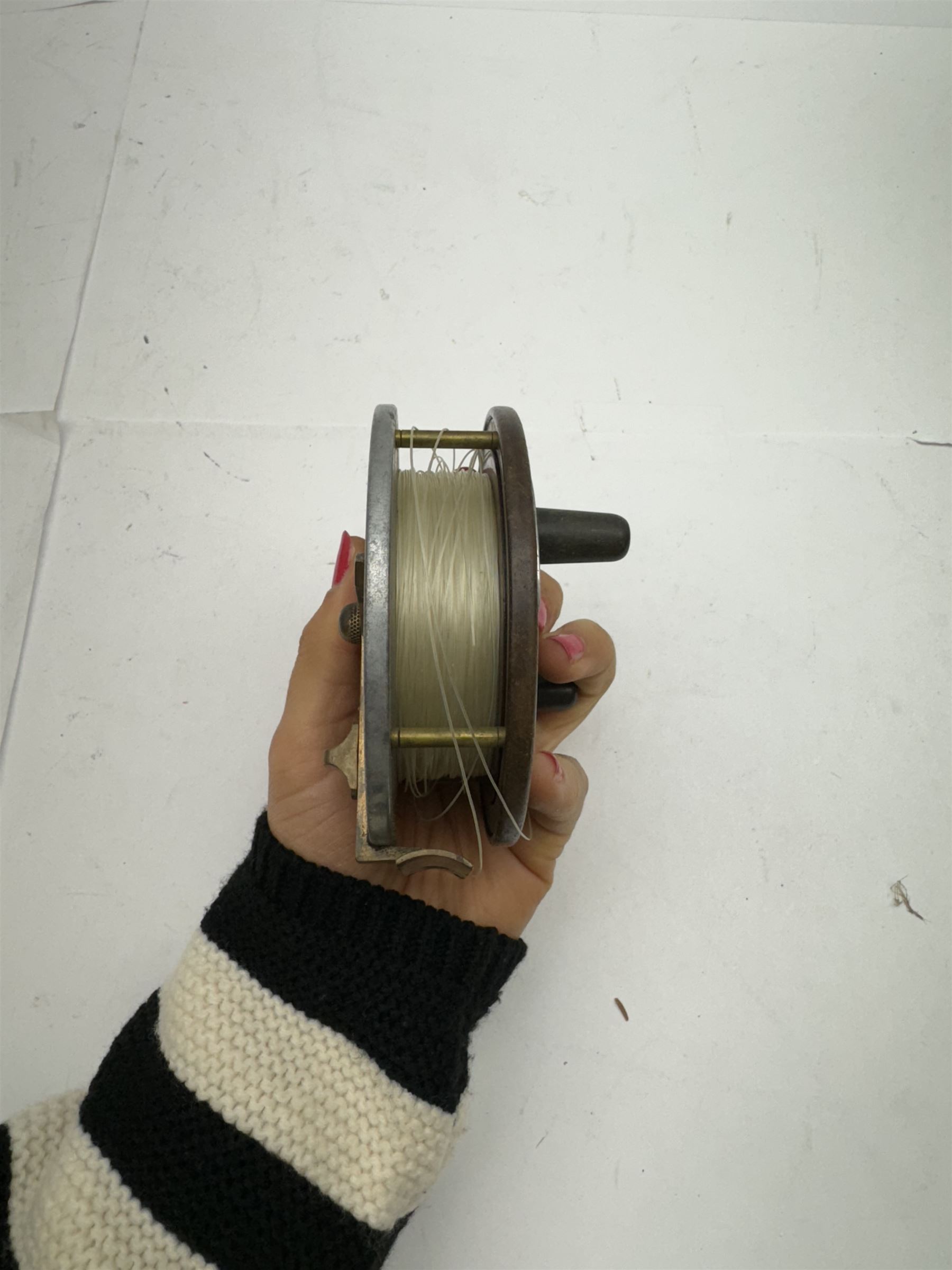 D. Slater, Newark, wood, alloy and brass star-back centre pin reel,  together with three other wooden/alloy reels including Edge Elite, Milbro Pelican and one other 