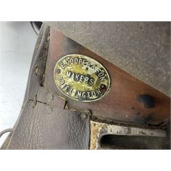 Collection of nine saddles, mainly havana leather to include a racing saddle and a Goodwin saddle, some with stirrups and leathers 