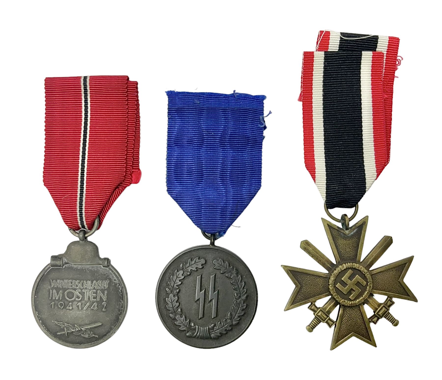 WWII German 'SS' Long Service Medal for four years; Ostfront Medal for the Winter Campaign in Russia of 1941-1942 'Die Medaille Winterschlacht Im Osten'; and War Merit Cross 2nd Class with swords; all with ribbons (3)