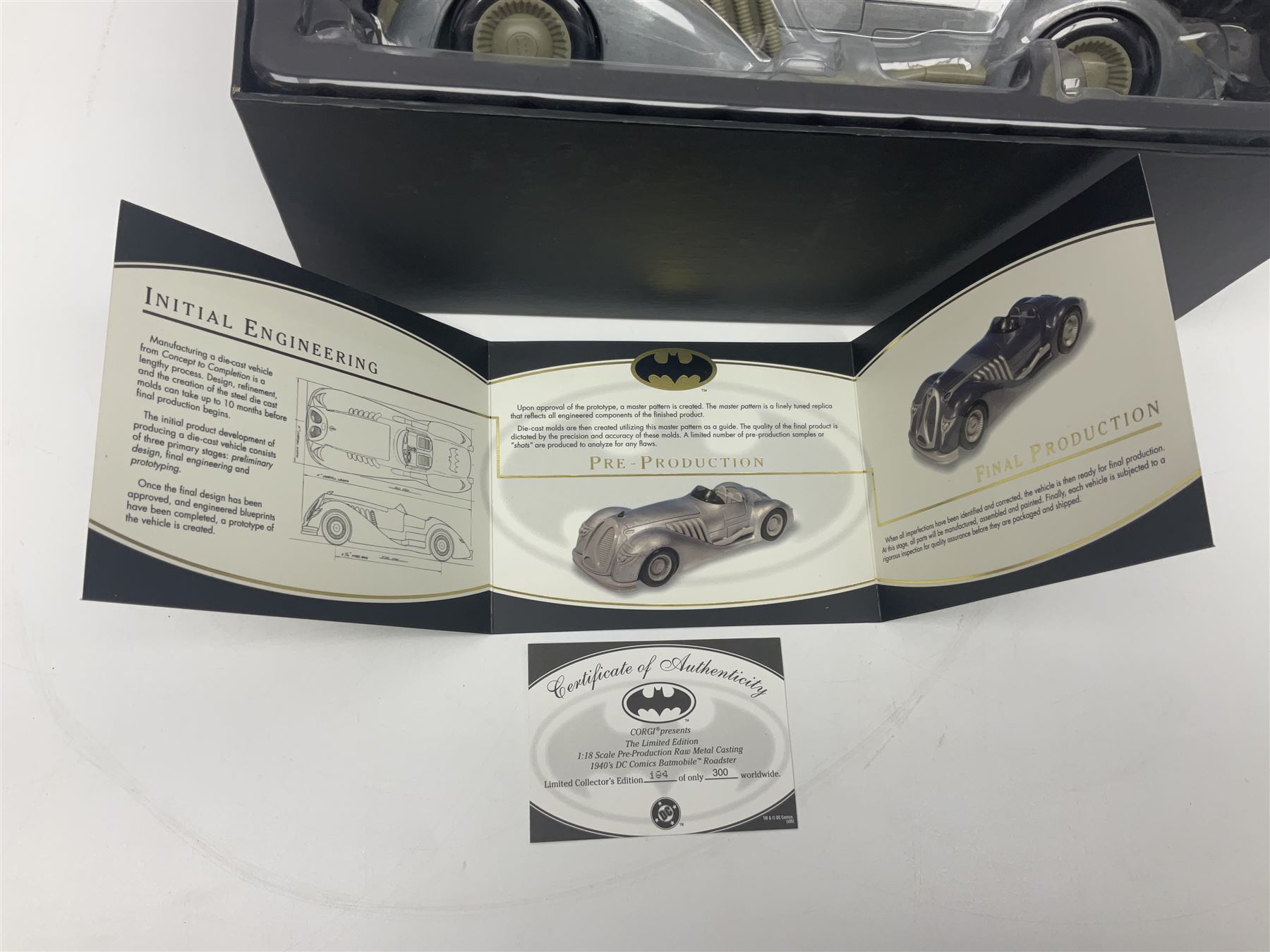 Two Corgi DC Comics die-cast Batmobiles comprising 1:18 scale die-cast Limited Edition Pre-Production Raw Metal Casting 1940 Batmobile Roadster no. 184/300, and 1:24 scale die-cast Limited Edition Raw Metal Casting 1960 Batmobile no. 858/1000, both with original boxes and certificates of authenticity 