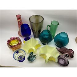 A group of coloured glassware, to include Art Glass examples, including a tapering grey glass vase, H32cm, a Wedgwood paperweight modelled as a bird, a Victorian green glass jug, H28cm, etc. 