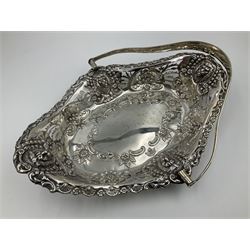 Edwardian silver swing handled basket, of navette form, with four repousse lion masks to each corner and with pierced and embossed floral, scroll and shell decoration to sides, base and handle, hallmarked Charles Horner, Birmingham 1906, height including handle H20cm