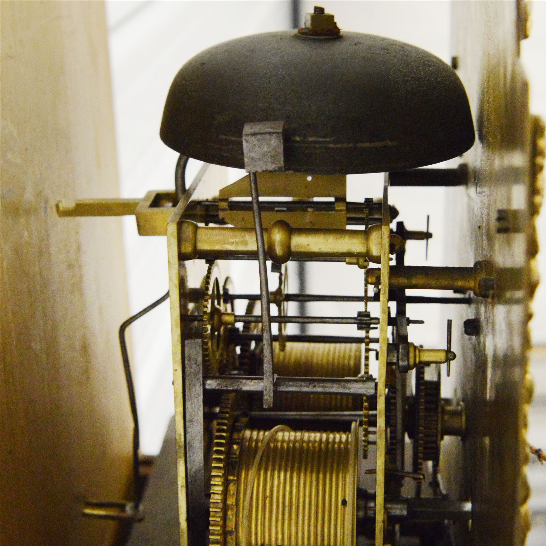 William Hayler of Chatham (Kent) - Fine George III black japanned chinoiserie decorated longcase clock c1760,  hood with a break arch top, glazed side panels and three matching wooden finials, conforming hood door beneath with attached pilasters, long trunk with a  break arch door and moulded surround, on a square double stepped plinth with a flat base, case and hood profusely decorated with scenes of gilt pagodas, temples, birds, people and panels of floral decoration, brass dial with cast brass spandrels and a silvered boss to the arch, silvered chapter with Roman numerals, minute track and five minute Arabic's, matted dial centre with seconds dial, date aperture, matching steel hands and silvered cartouche with makers name, dial pinned directly to a five-pillar rack striking movement with a recoil anchor escapement. With  pendulum, weights  and key.
William Hayler is recorded as working in High Street, Chatham, from 1750-1810, possibly two makers (father & son) working in succession.

