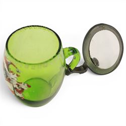 19th century German green glass stein, enamel decorated with a gentleman holding a stein, with a pewter lid, together with another smaller example decorated with a coat of arms 