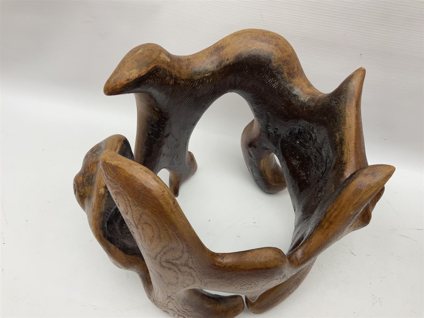 Helen Skelton (British 1933 – 2023): Two carved wooden abstract sculptures, one modelled as a entwined knot, largest H48cm. Born into an RAF family in 1933 in Kent and travelled the world extensively during her childhood. After settling in Bridlington, Helen immersed herself in painting, textiles, and wood sculpture, often inspired by nature's beauty. Her talent was showcased in a one-woman show at Sewerby Hall and recognised with the sculpture prize at Ferens Art Gallery in 2000. Sadly, Helen’s daughter passed away from cancer in 2005. This loss inspired Helen to donate her sculptures to Marie Curie upon her passing in 2023.