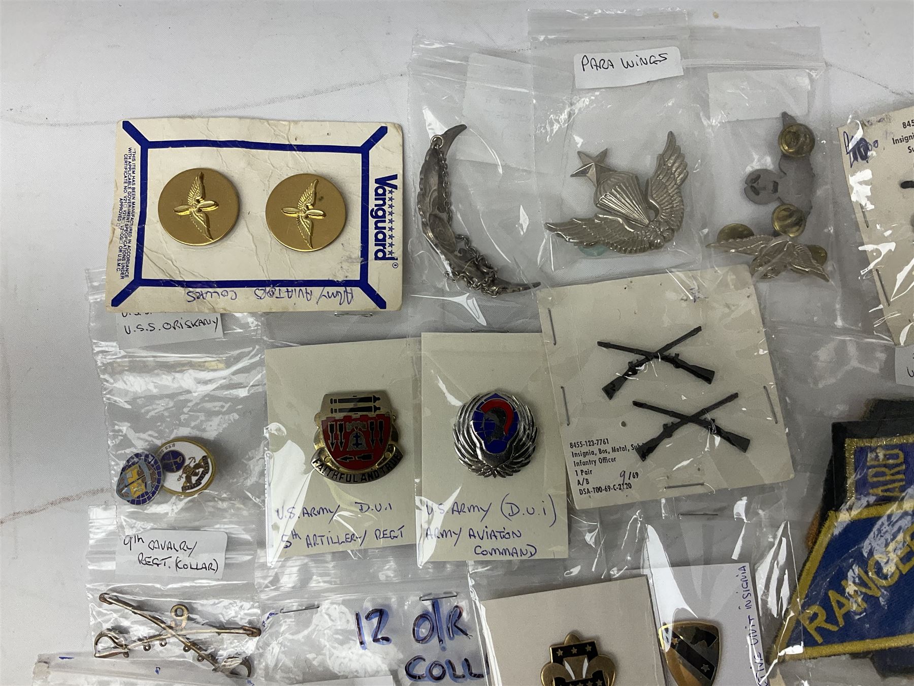 American patches and badges, including para wings, USS Constellation, Strategic Air Command, U.S. military academy, health service regt, Navy Seals, Air Defence Command, Seventh Fleet, various collar badges etc