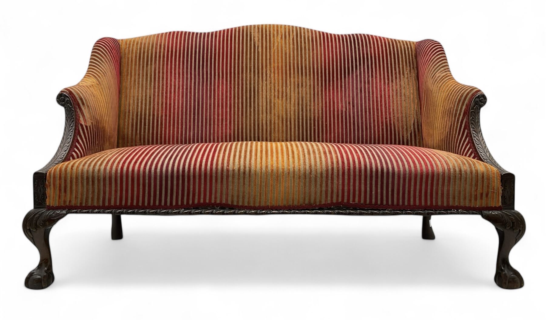Mid-19th century mahogany two-seat sofa, upholstered in striped velvet fabric, the shaped backrest leading to outward-curved arms, carved apron with scrolling foliate details, raised on cabriole supports terminating in claw and ball feet