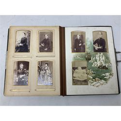 Victorian desk ink blotter, decorated with painted spray of flowers within stylised gilt rococo spandrels with mother of pearl fixings, together with a Victorian photo album containing interior leaves with apertures of various sizes and shapes of portraits surrounded by printed sea and dock scenes, blotter L28cm