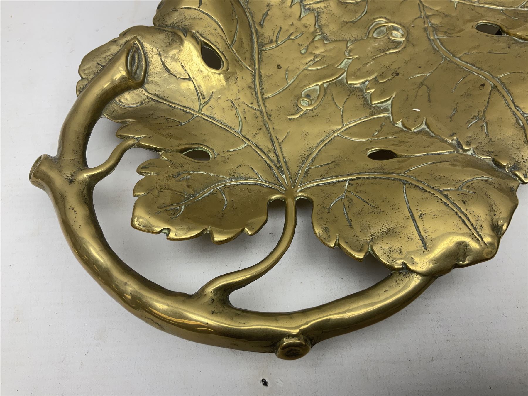 Late 19th/early 20th century twin handled brass centrepiece dish in the form of oak leaves, raised upon four legs, L37cm