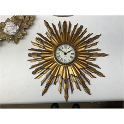 Pair of gilt wall brackets with composite relief in the centre, together with a gilt wall clock and a similar wall hanging