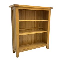 Light oak bookcase, fitted with two shelves