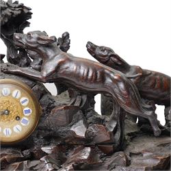 19th-century-8-day German Black Forest mantel clock c1880, with a carved oak case depicting a hunting scene with a stag pursued by hounds amidst rockwork and oak foliage, fitted with a French Parisian movement with a cast brass dial enclosed within a glazed brass bezel with a pendulum adjustment arbor, cartouche blue-on-white enamel  Roman numerals, engraved five minute Arabic's and contrasting steel Fleur-di-Lis hands, twin train going barrel movement with a recoil anchor escapement and countwheel strike. With pendulum.  