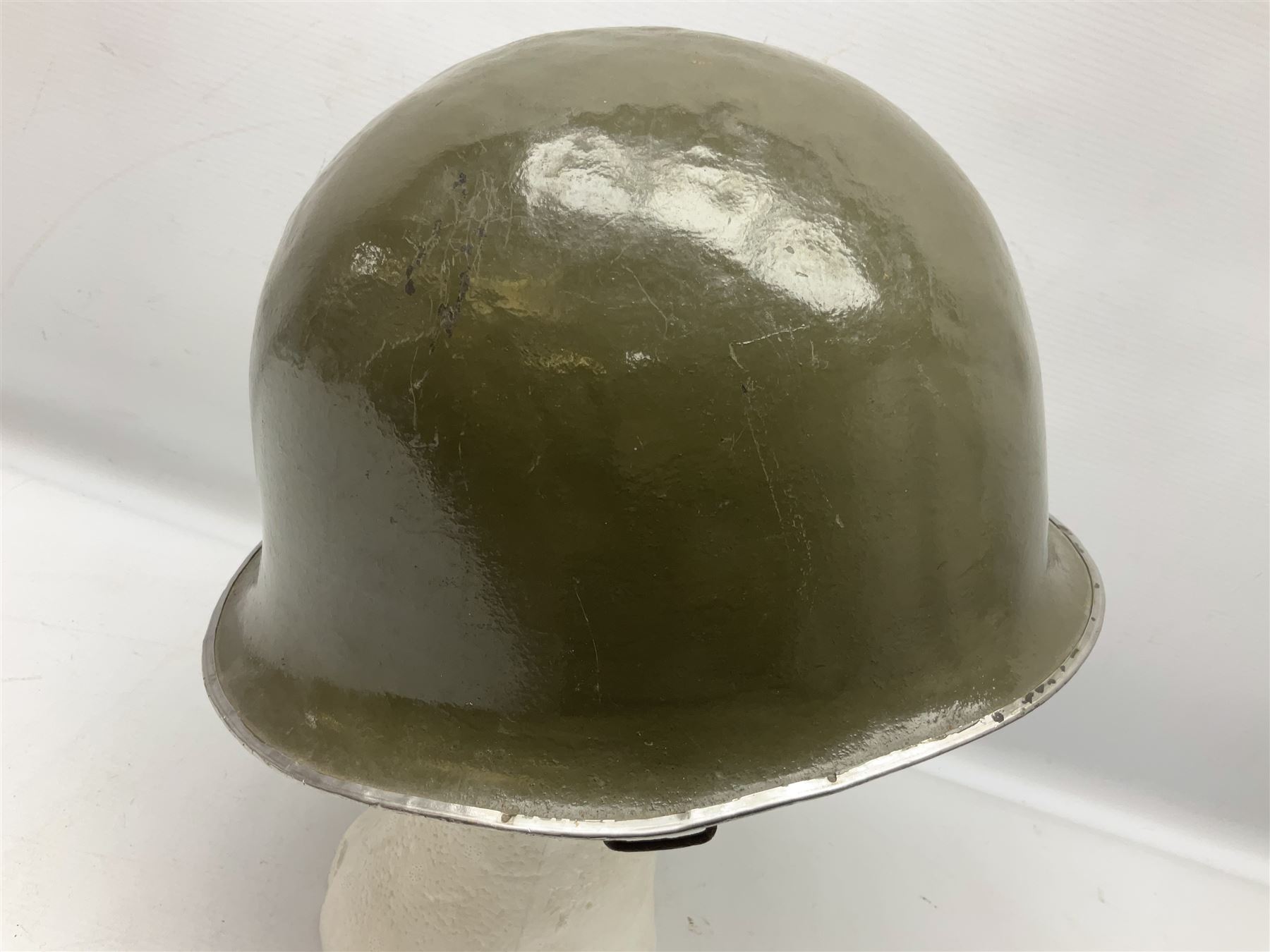 1950s French Algerian War steel helmet with liner; indistinctly marked 'S.I.A. LE EANS(?) 71R'