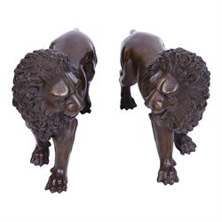 Pair of opposing bronze lions, H22.5cm L27cm