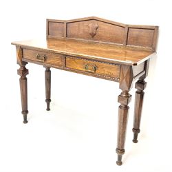 Late Victorian oak side/console table, raised arched back with beaded detail and applied shield shaped mount, rectangular chamfered top over two drawers, tapering octagonal supports