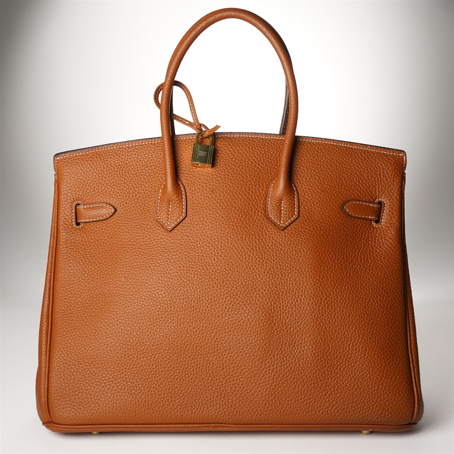 Hermès - gold hardware 'Birkin 35' handbag in gold Togo leather with white stitching, featuring gold-plated hardware, double rolled handles, front flap, belted turn-lock closure, and leather lining with one zip and one slip pocket, stamped 'Hermes Paris Made in France' in gold, with blind-stamp Q (2013) with craftsman’s code 70A to the underside of locking belt. Accompanied by: padlock, keys, clochette, Hermes dust bag, booklet, and ribbon. New unused condition.