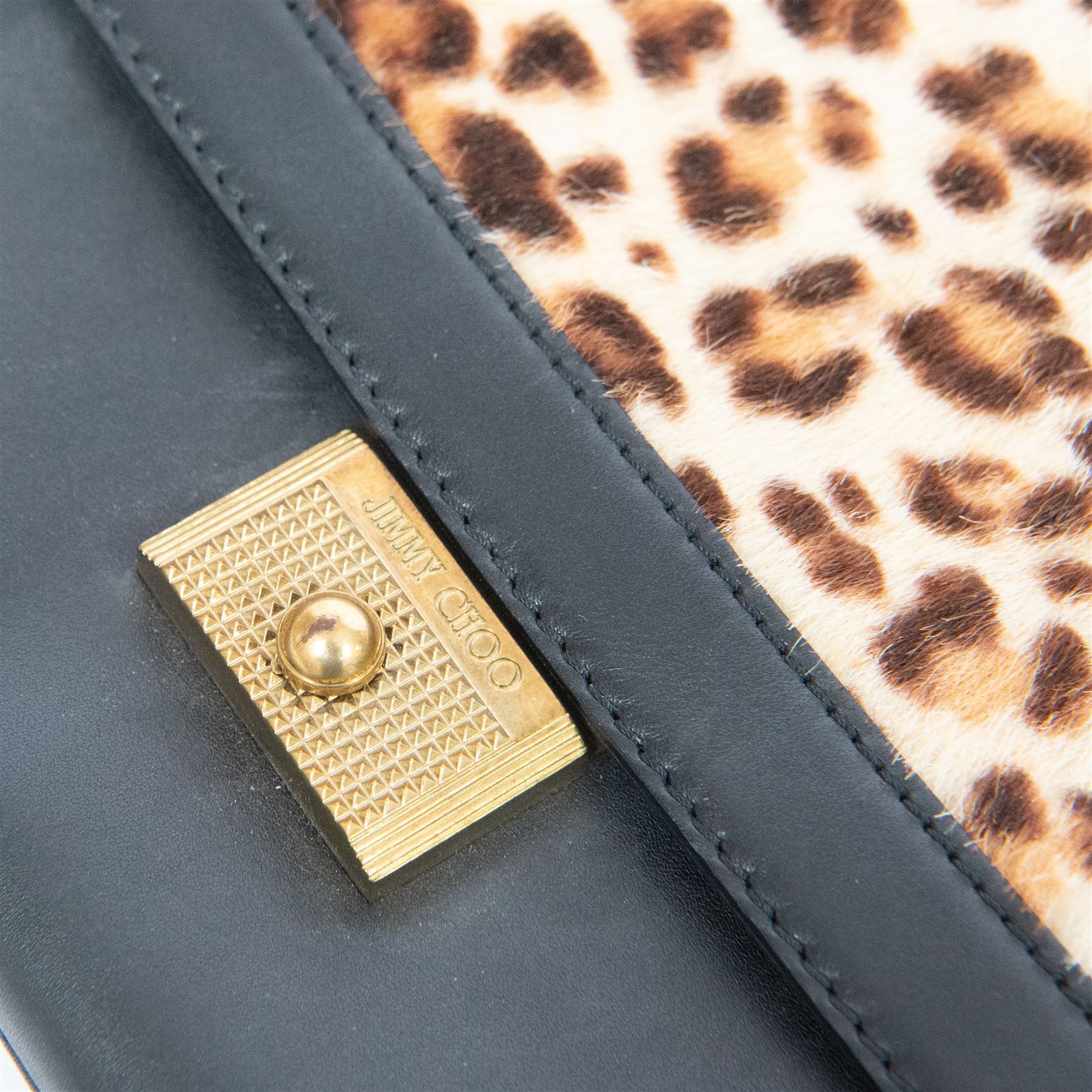 Jimmy Choo black leather and leopard-print calf hair shoulder bag, the rectangular form with leopard-print flap panel, gold-tone push-lock fastening and chain-link shoulder strap with leather shoulder pad, suede-lined interior with zip pocket and maker’s plaque stamped Jimmy Choo Made in Italy, with dust bag