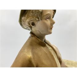Royal Dux figure modelled as a young boy holding a bull on naturalistic base, with applied pink triangular mark and impressed 1494 and stamp beneath, H27cm