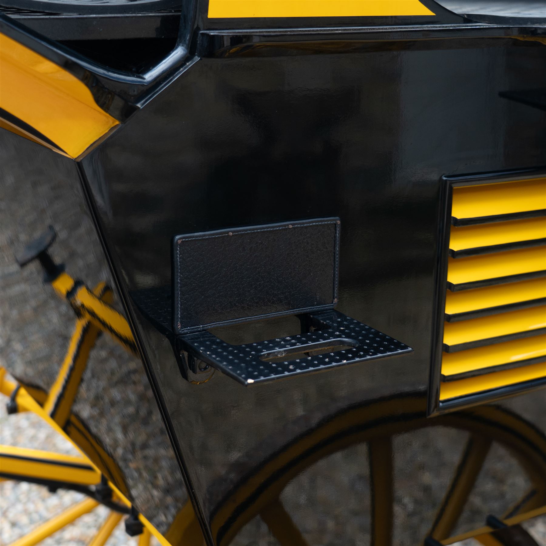 Roof Seat Break by Shanks of London

A roof seat break by Shanks of London built on a perch in black and yellow livery, the body fitted with an elevated driver's box seat, elevated rear groom's seat and central passenger compartment. The carriage is mounted on wooden spoked wheels with leaf spring suspension and is equipped with louvred underbody storage compartments, carriage lamp brackets (lamps next lot), folding access steps and a pole for driving with a pair or team of horses. The wheel hubs are stamped 
